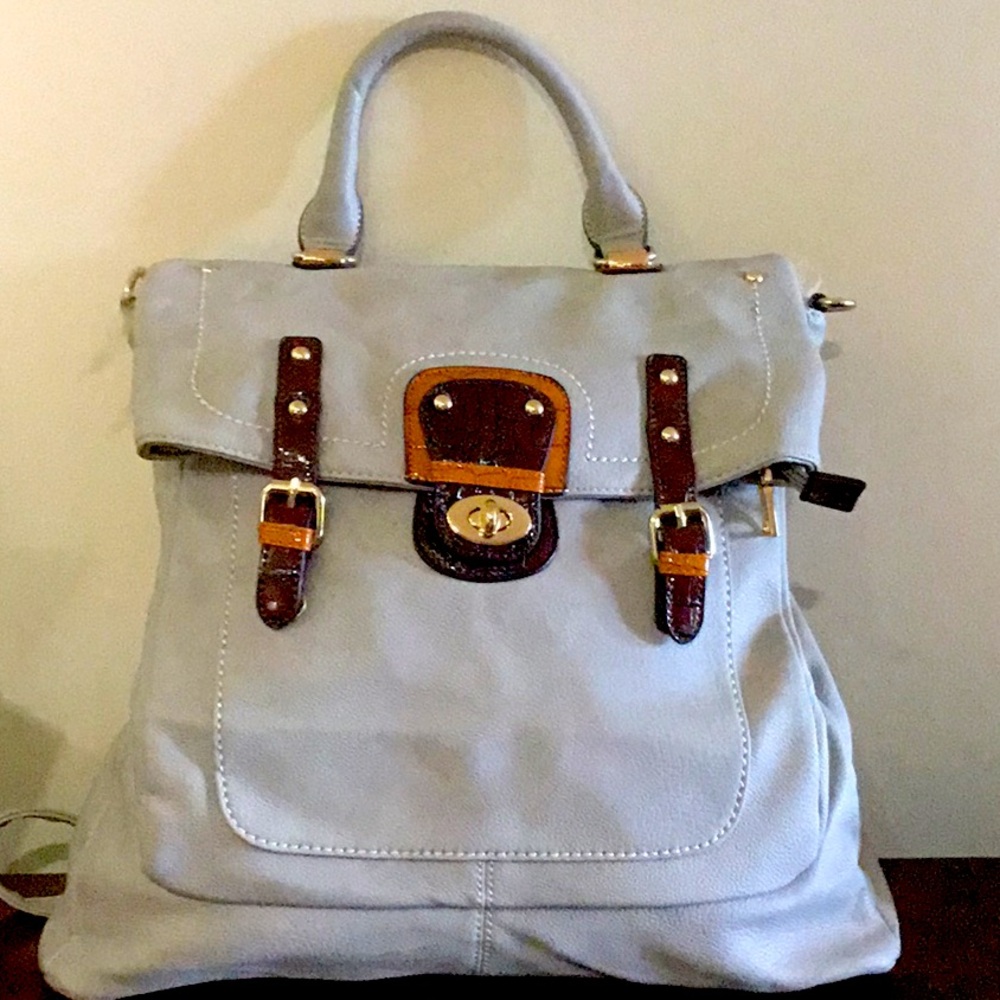 Black Rivet Gray leather medium backpack. Never used.Brown and brass accents.